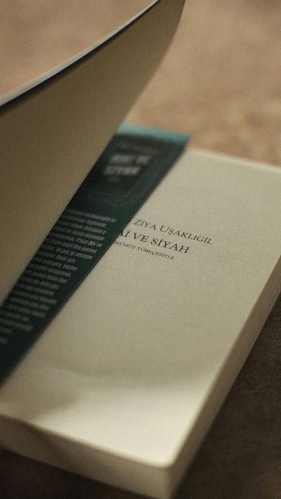 pexels-photo-21363393-21363393 Close-up of an open book with a bookmark in İstanbul, Türkiye, highlighting literary details.