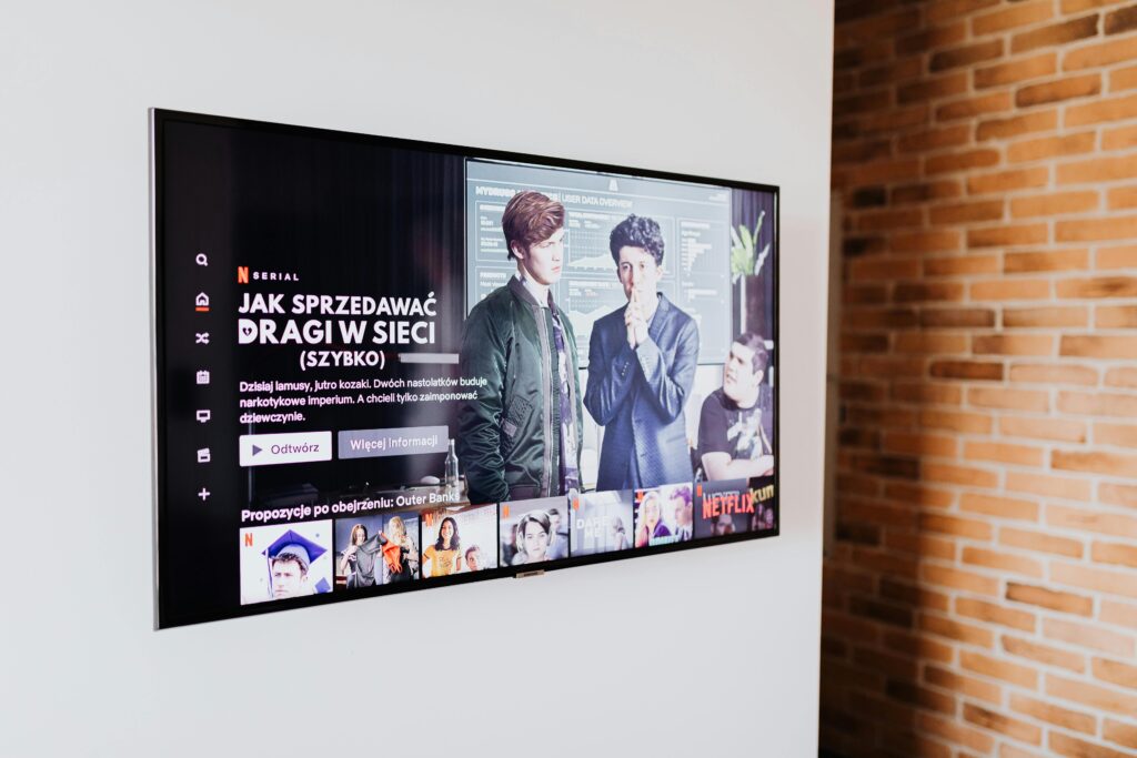 pexels-photo-5202925-5202925 Smart TV displaying streaming content in modern living room setting with exposed brick wall.